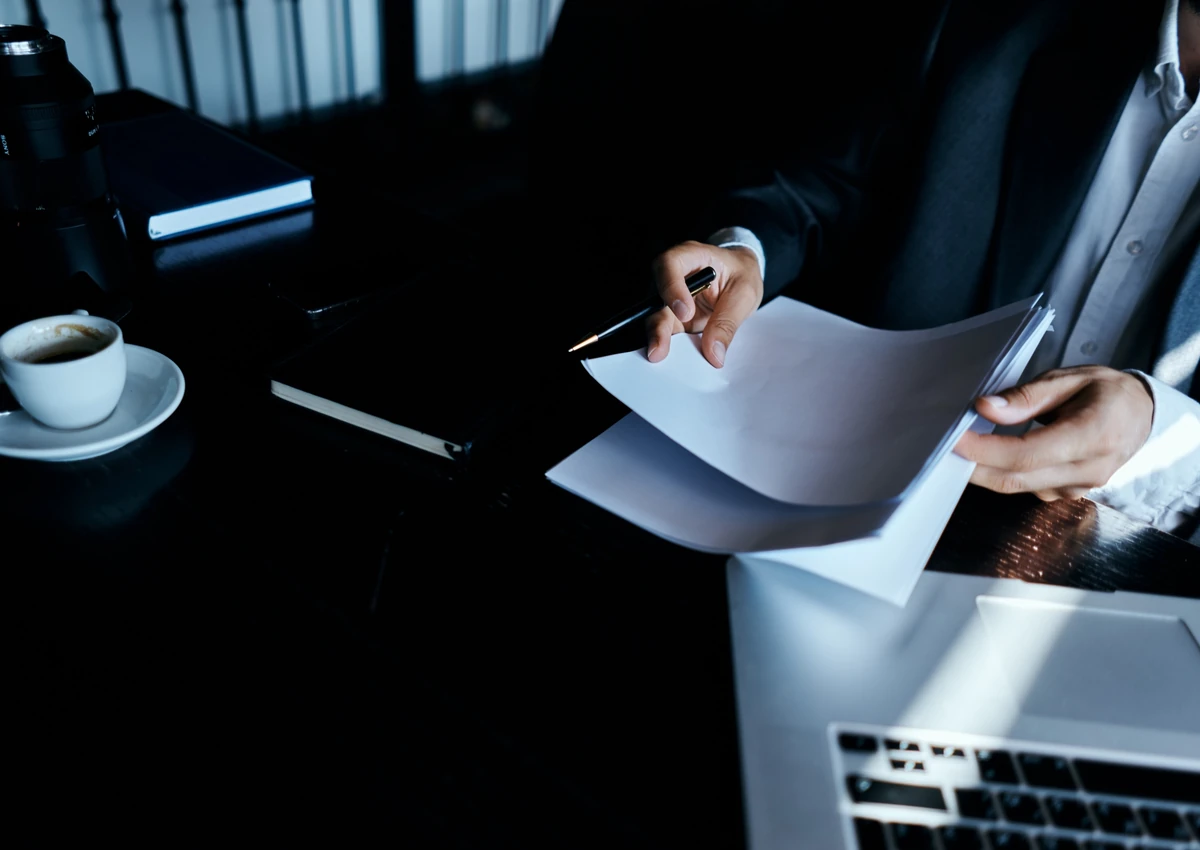 Business documents and financial records being reviewed