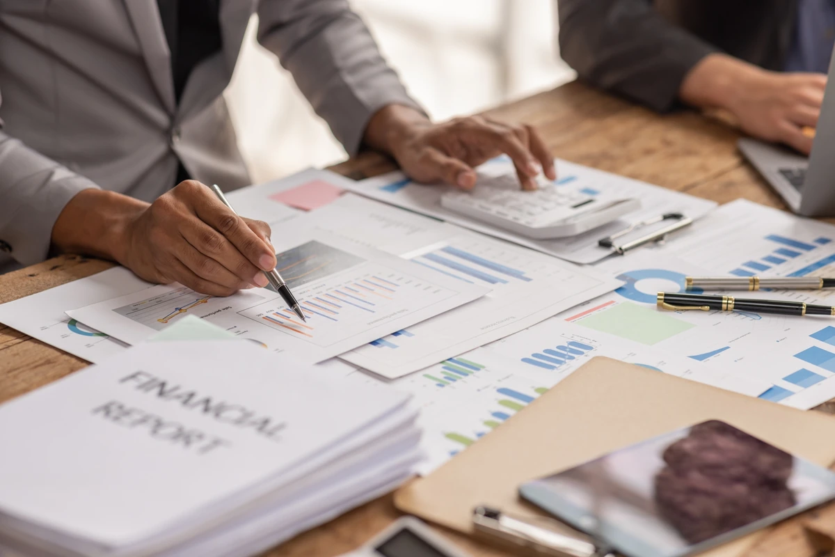 Business documents and financial records being reviewed